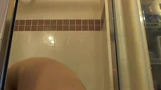 Blonde slut masturbating in the shower