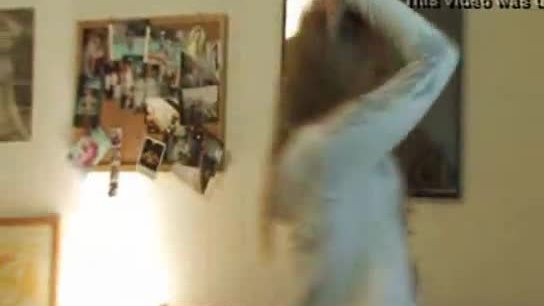 Brittany dancing on her bed